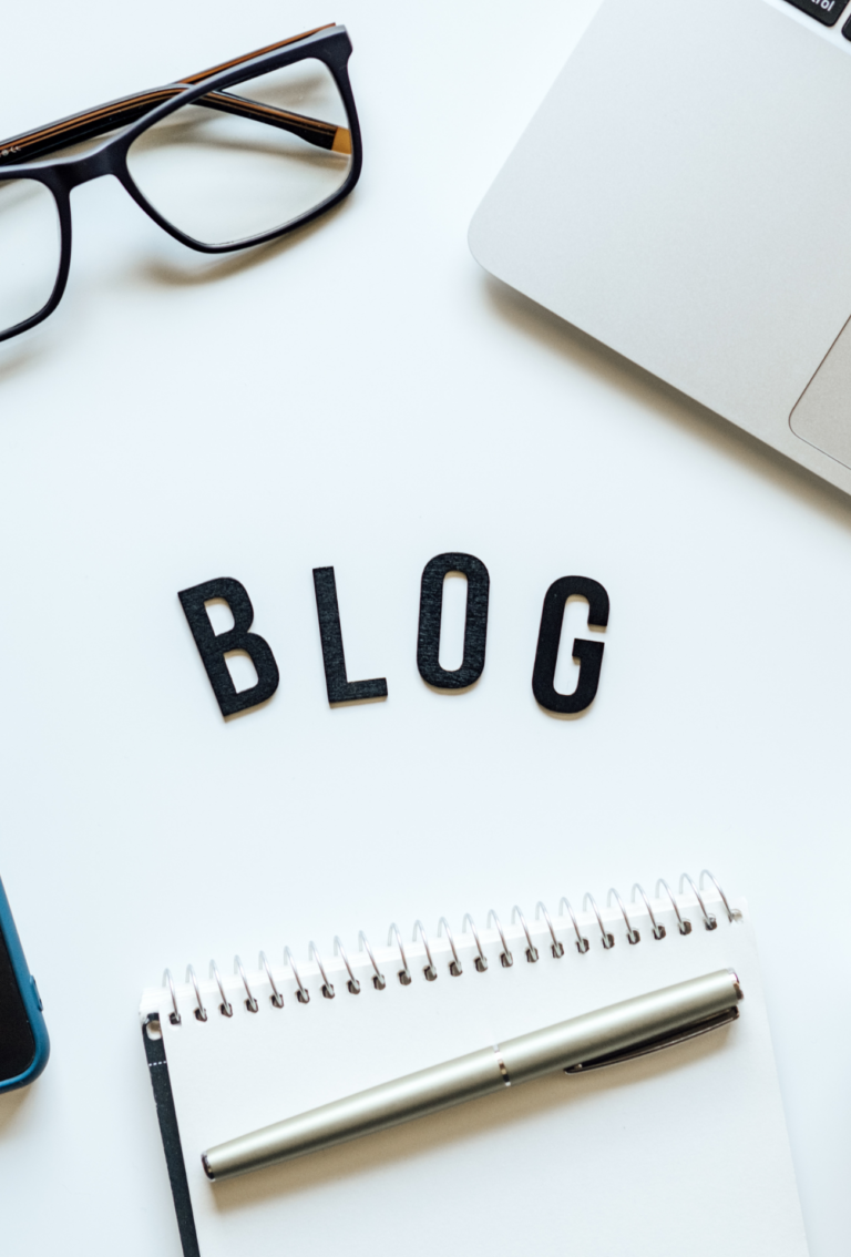 How To Start Blog, Blogging for Beginners. Ways to monetize your blog. Blog word on table with laptop, smartphone, open notebook, dollar banknotes and glasses